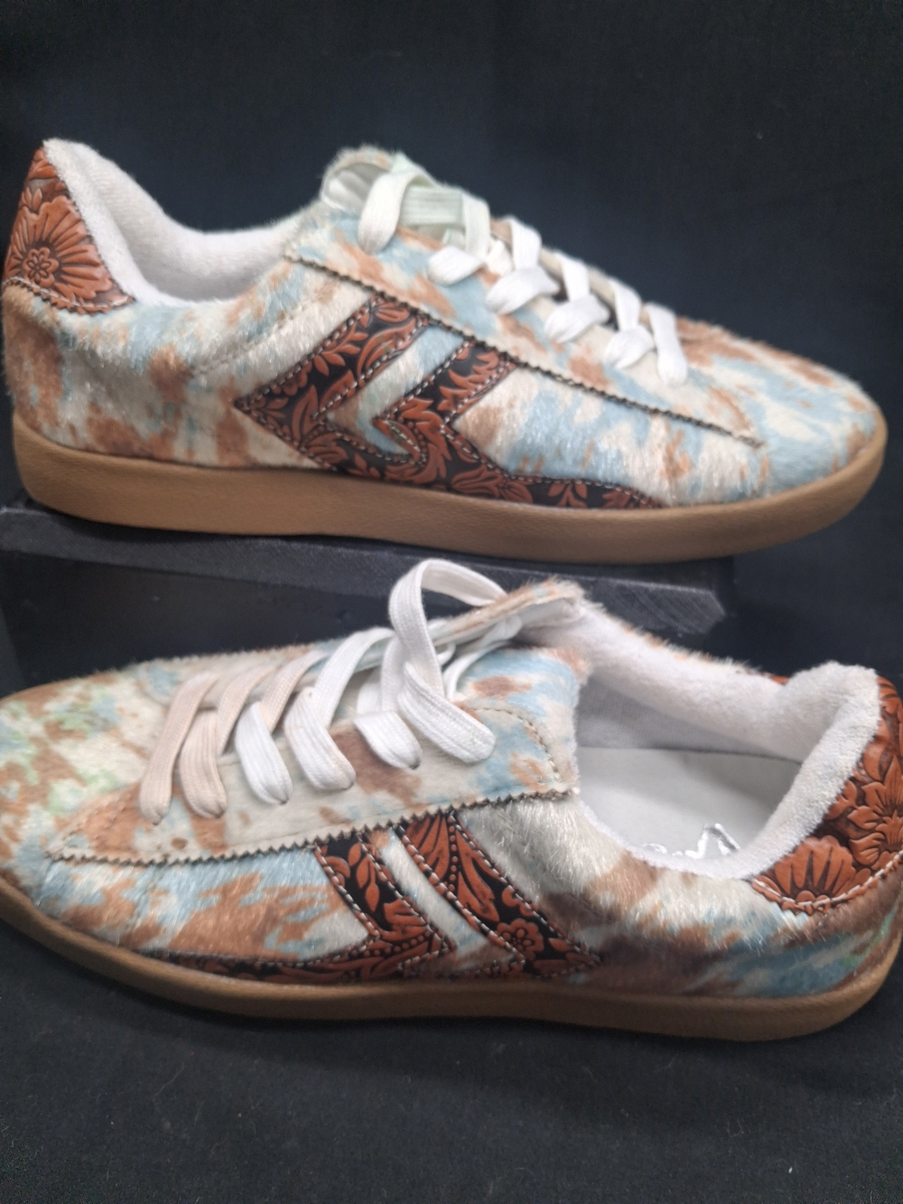Very G Eva Sneaker. Turquoise And Tan Cow Print With Leather Floral Accents.